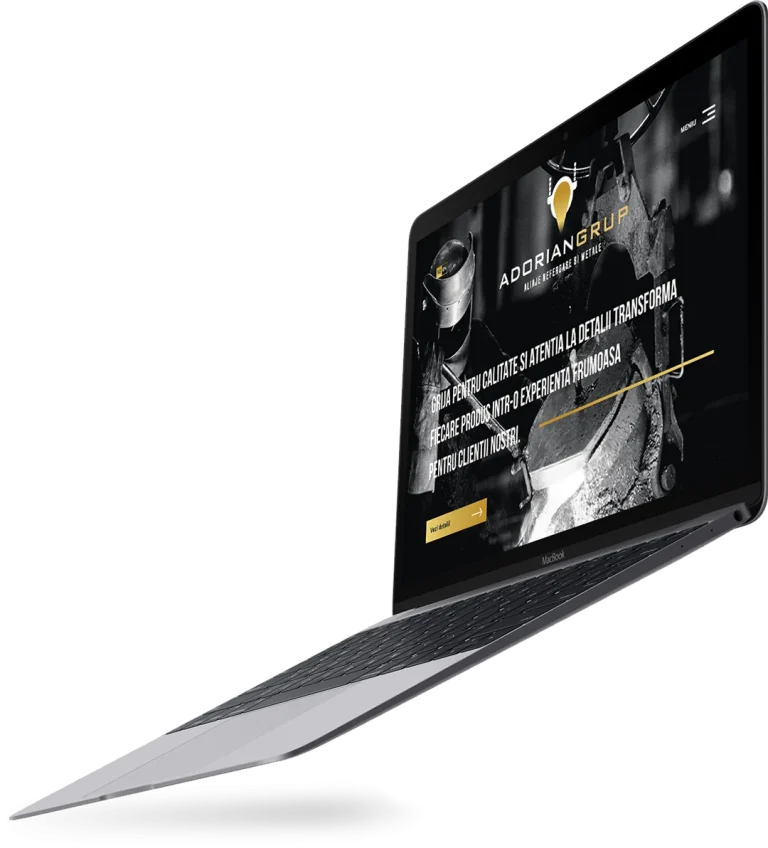 Laptop deschis cu un site web elegant, în tonuri închise, realizat de ADC