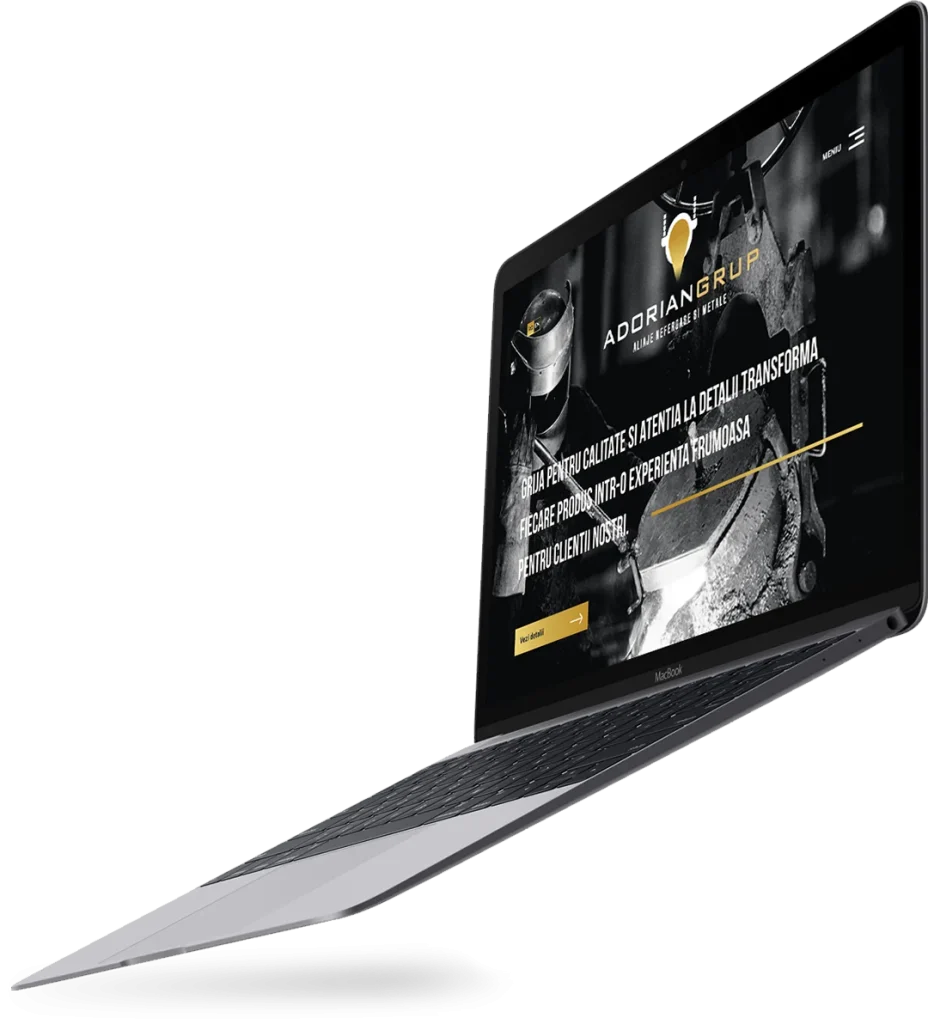 Laptop deschis cu un site web elegant, în tonuri închise, realizat de Agenția de Creație